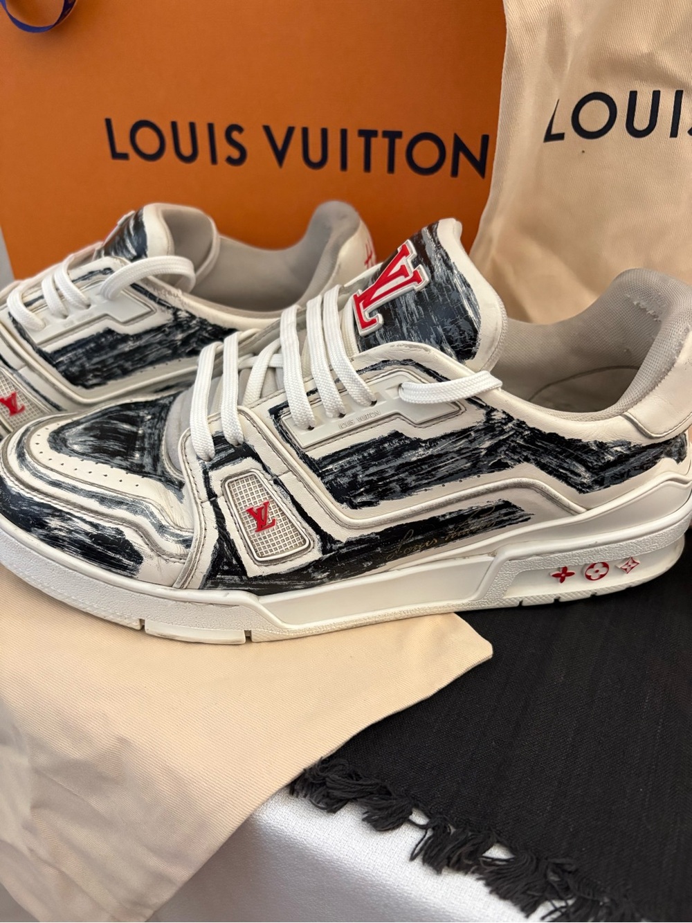 Louis Vuitton Men’s White Sneakers with Black Brushstroke and Red Accents